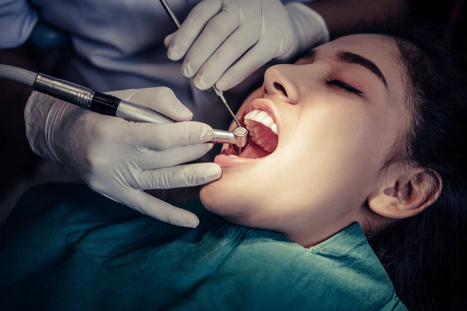 Dentist treats patients teeth